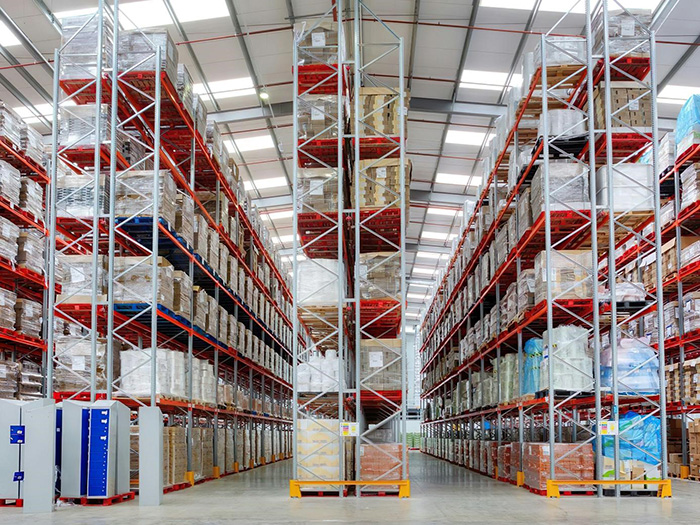 Prefabricated warehouse building utilizing a steel frame.