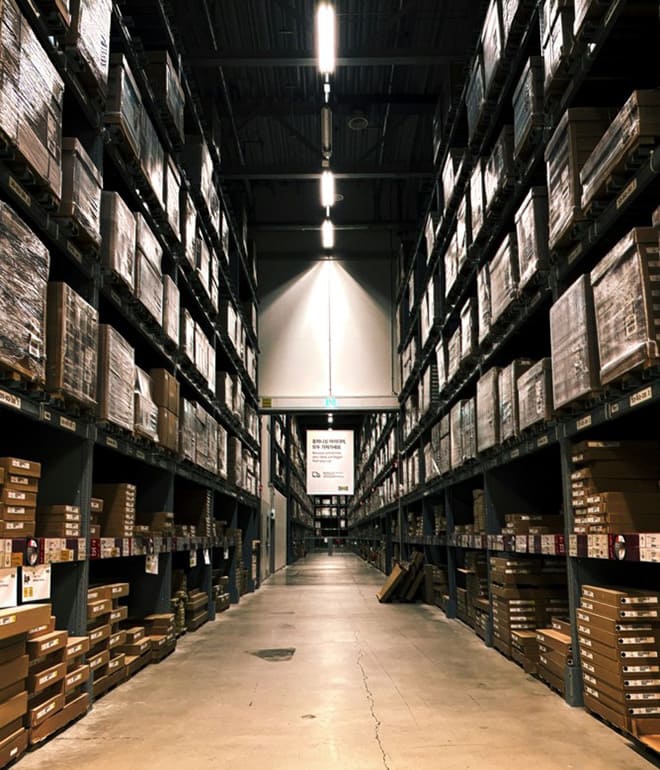 Modern stainless steel warehouse interior with industrial shelving systems